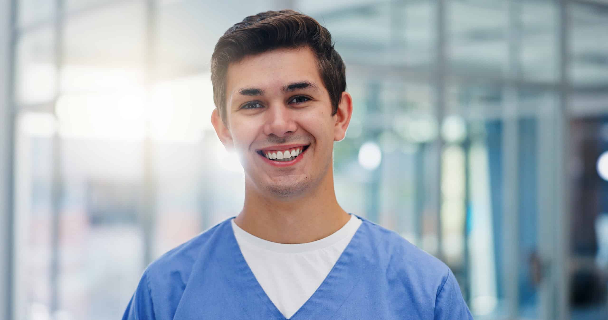 Nurse, happy and portrait of man in hospital for medical service, medicine internship and studying. Healthcare, professional and face of med student with smile, confidence and ready for career